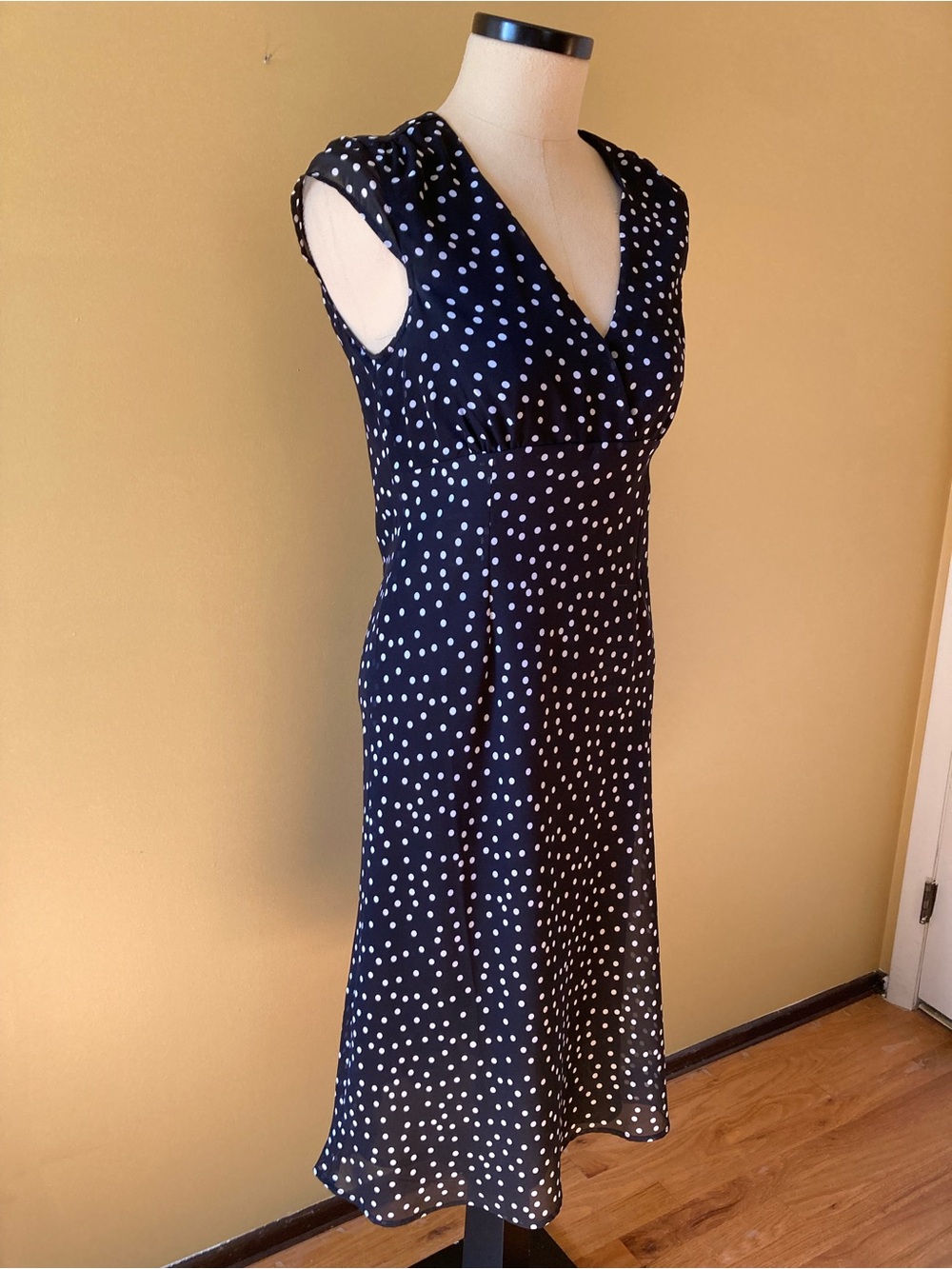 Women’s Polka Dot v neck tea length dress in black and white. Rayon crepe.